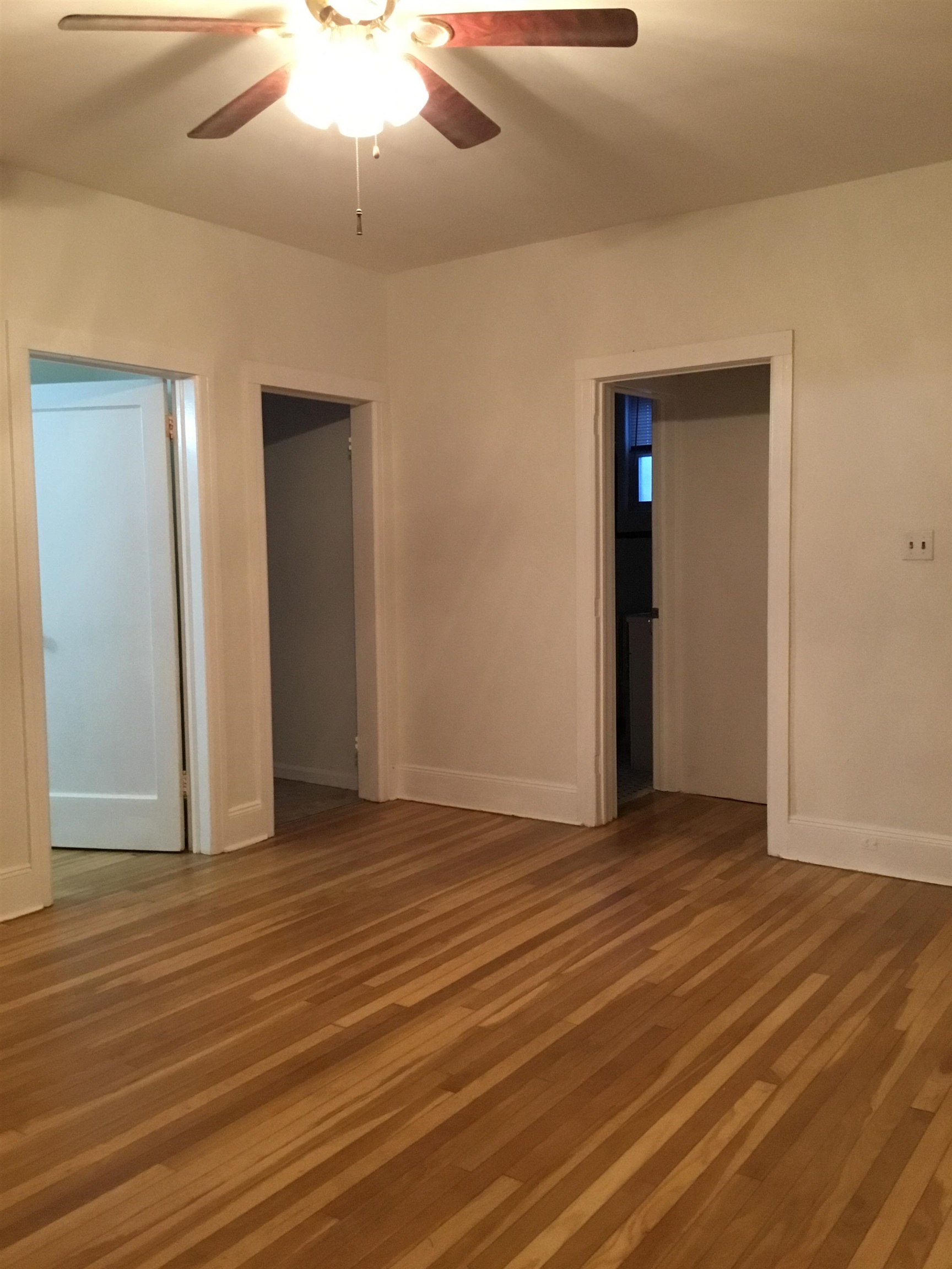 1407 70th Street, Unit 2 North Bergen, NJ 07047 - Photo 18 of 22 a view of an empty room with wooden floor