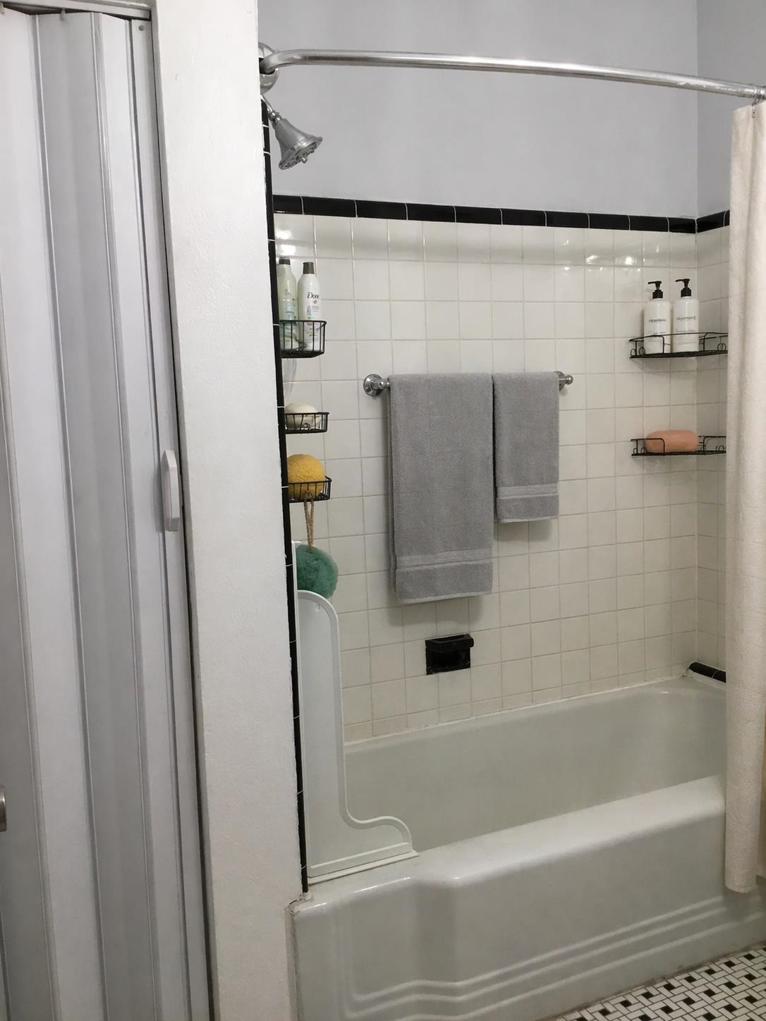 1407 70th Street, Unit 2 North Bergen, NJ 07047 - Photo 22 of 22 a bathroom with a shower and a bath tub