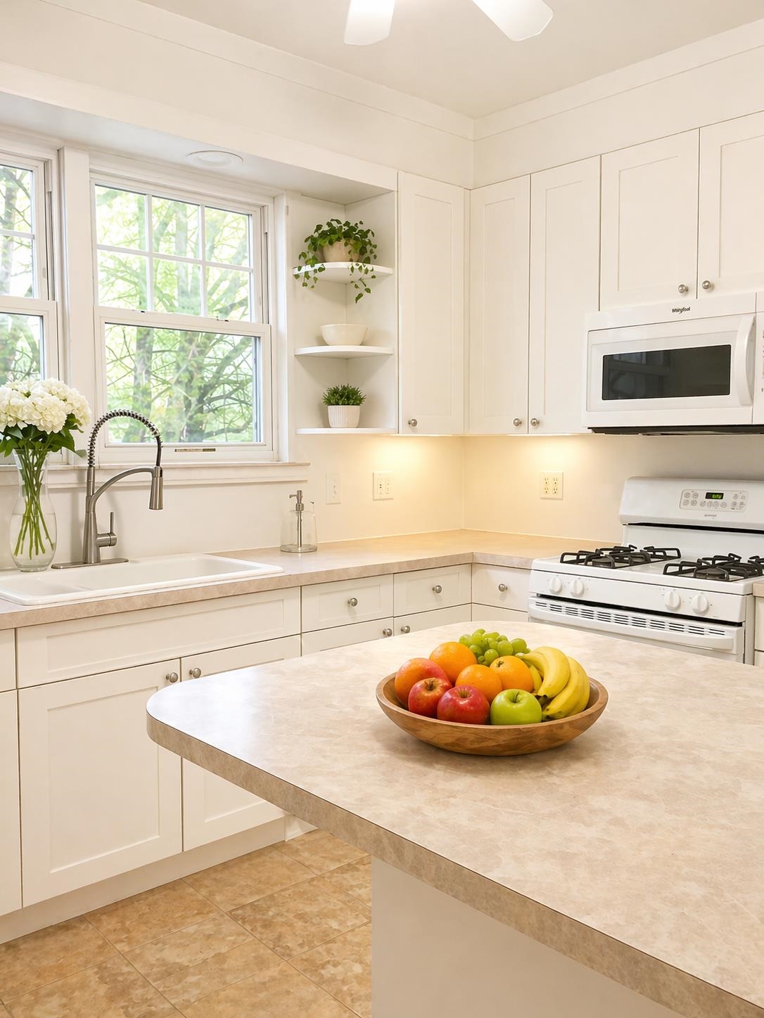 1407 70th Street, Unit 2 North Bergen, NJ 07047 - Photo 4 of 22 a kitchen with a sink a stove and white cabinets