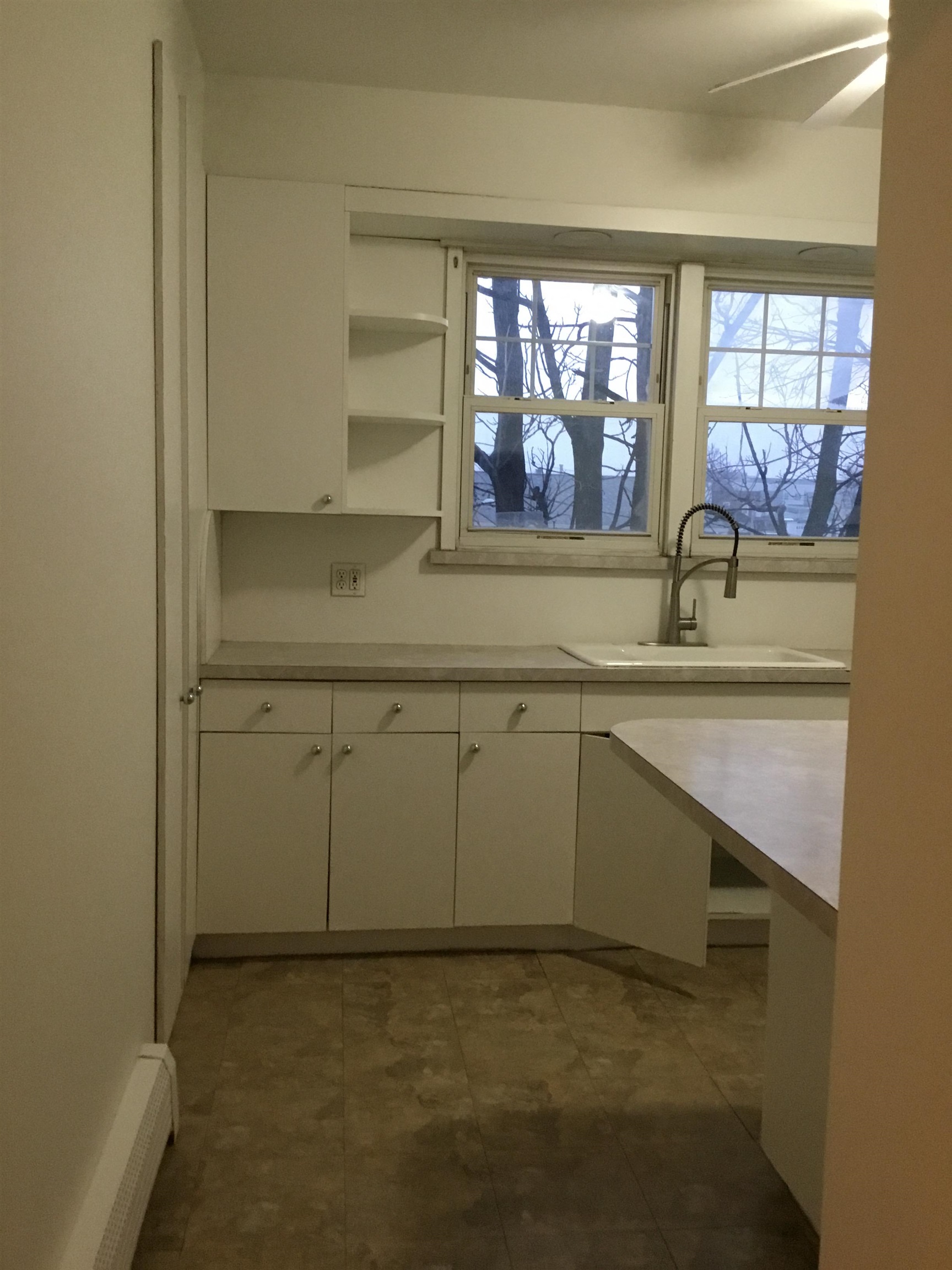 1407 70th Street, Unit 2 North Bergen, NJ 07047 - Photo 6 of 22 a kitchen with a sink and a window