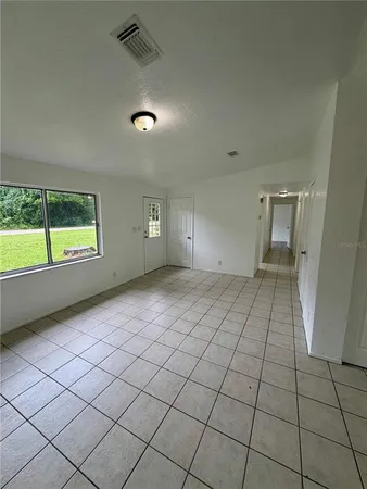 a view of an empty room and window