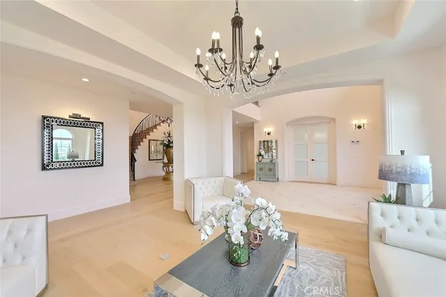 a dining room with furniture a flat screen tv and a large window