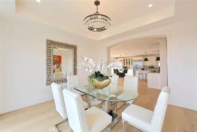 a large kitchen with a table and chairs