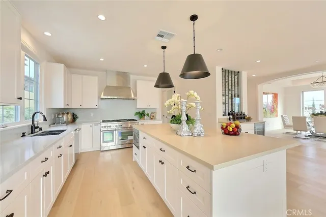 a bedroom with furniture and a large window