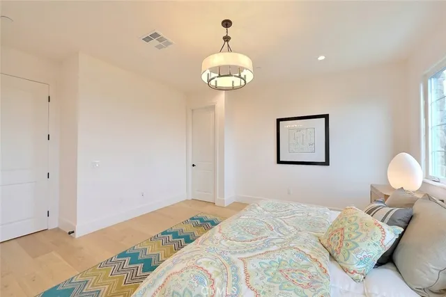 a bed room with a bed and a window