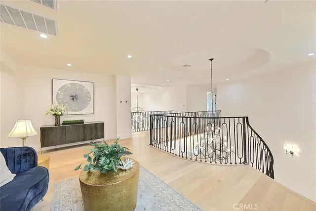 a view of a dry yard with wooden fence