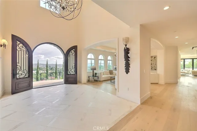 a view of a livingroom with furniture and a chandelier