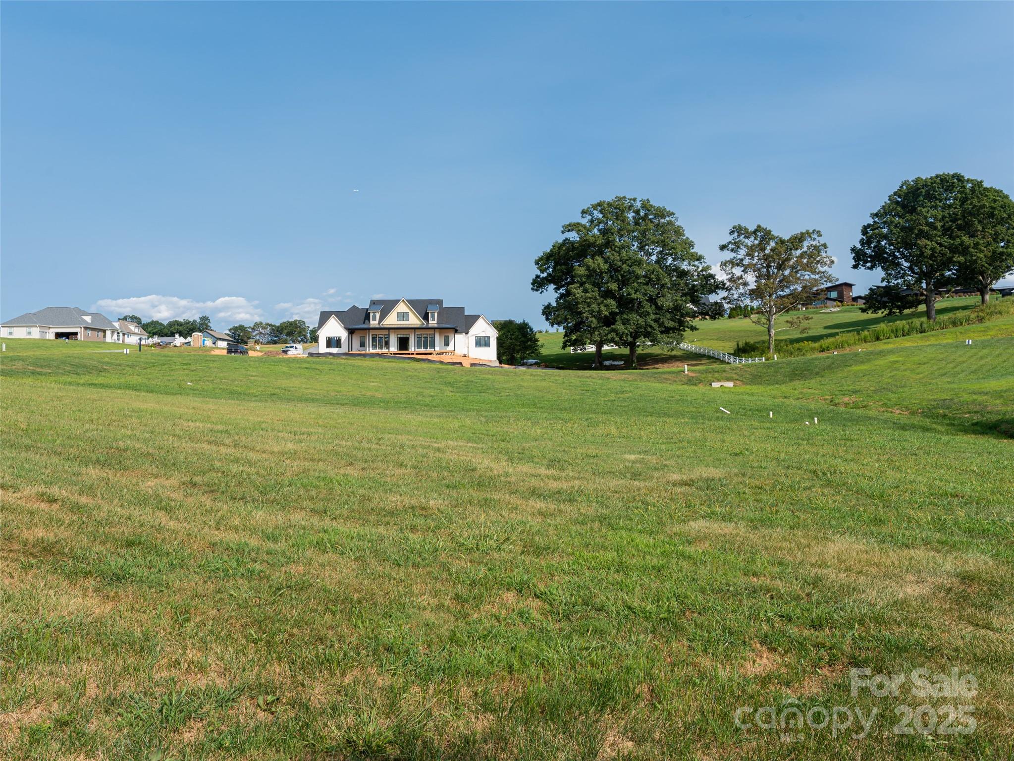 109 Double Knob Road, Unit 66 Mills River, NC 28759 - Photo 8 of 10 a view of a grassy field with trees