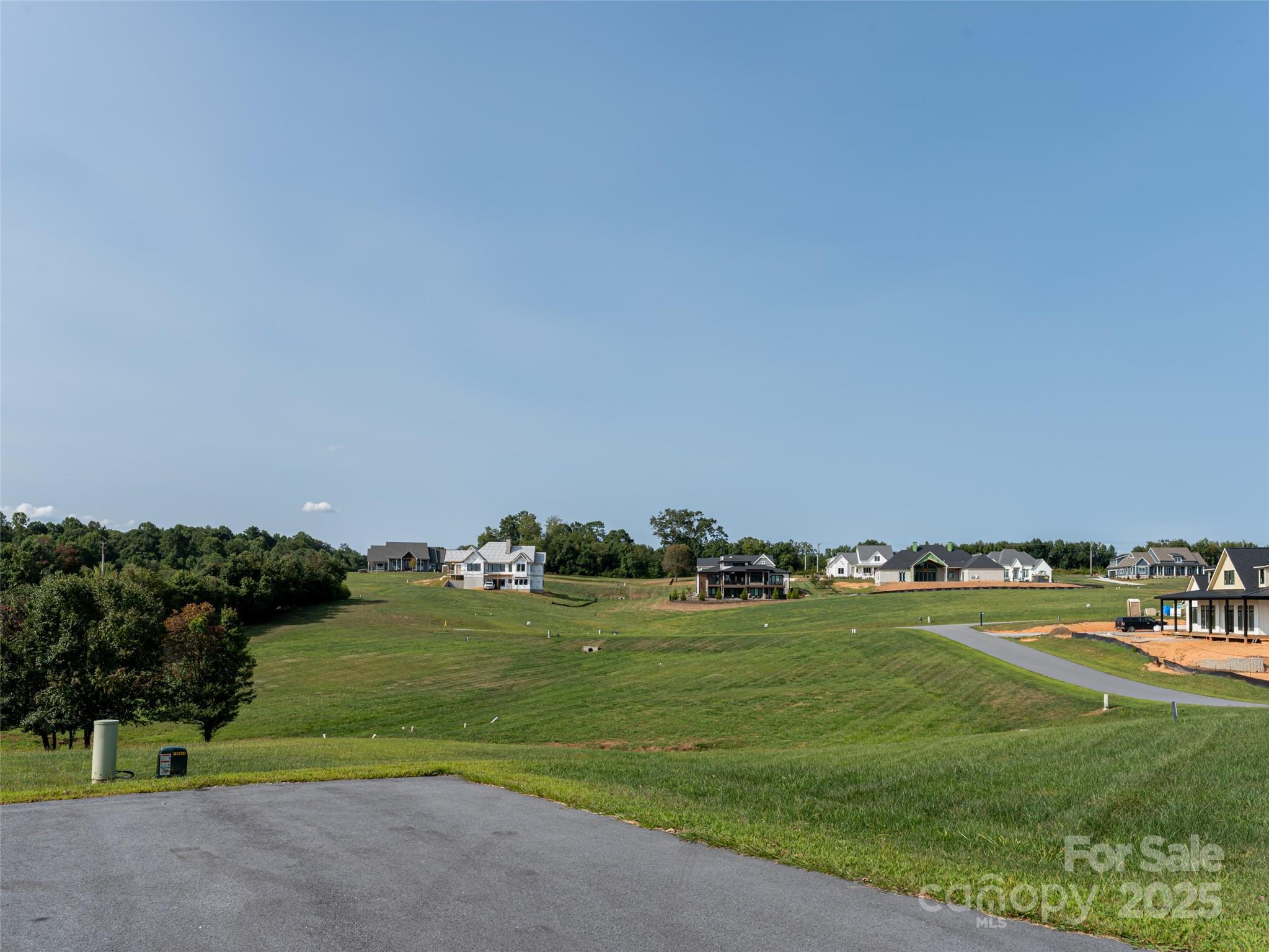 109 Double Knob Road, Unit 66 Mills River, NC 28759 - Photo 10 of 10 a view of a golf course with a field