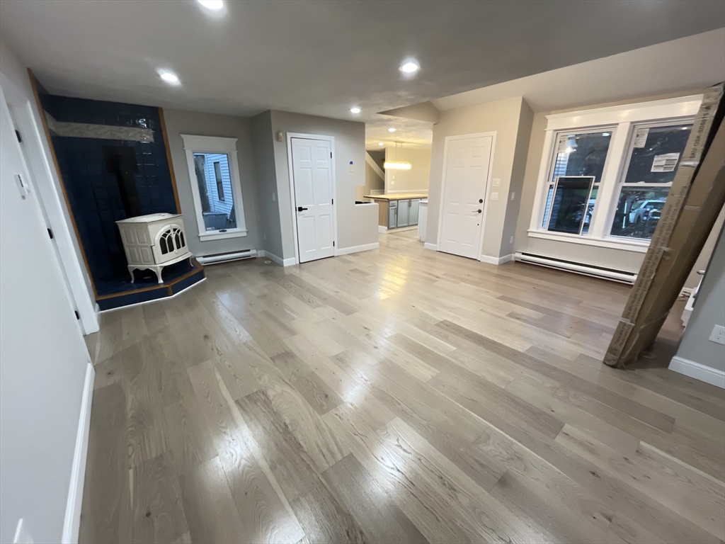 33 Highview Road Rockport, MA 01966 - Photo 18 of 31 an empty room with wooden floor and windows