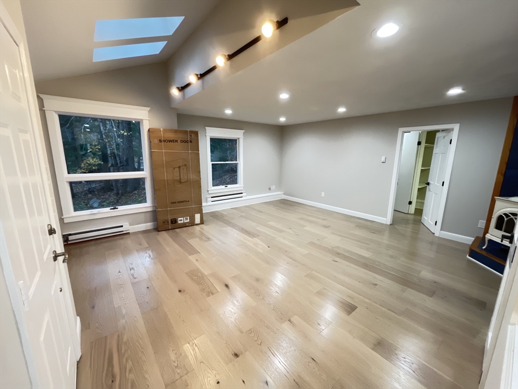 33 Highview Road Rockport, MA 01966 - Photo 19 of 31 an empty room with wooden floor and window