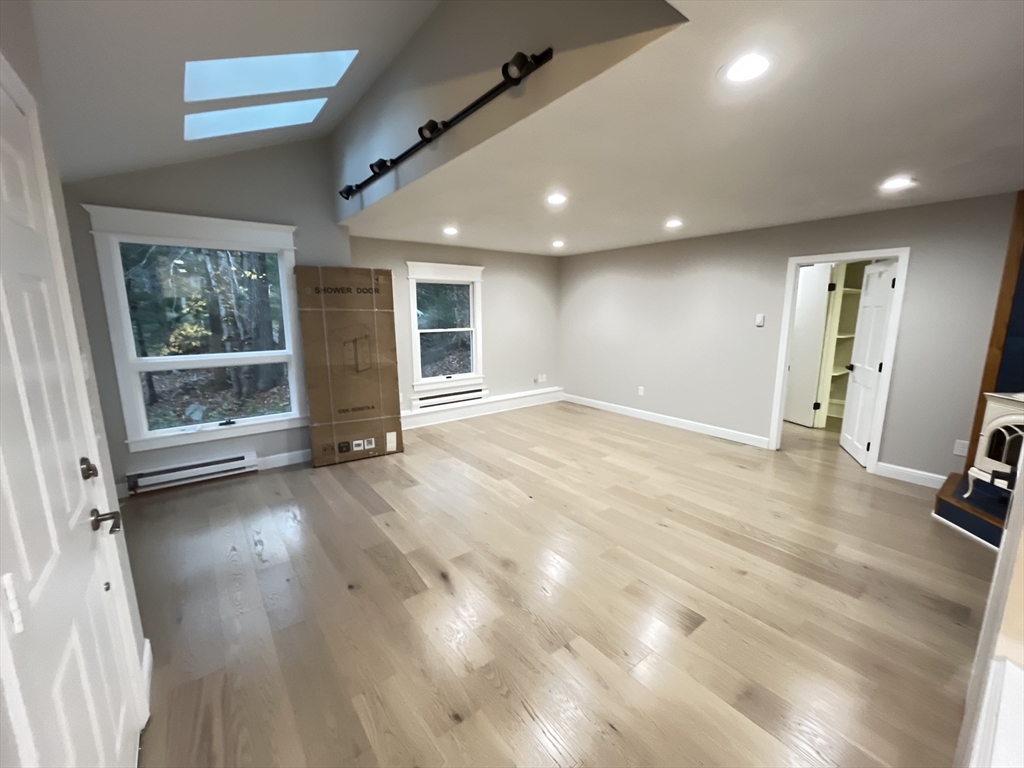33 Highview Road Rockport, MA 01966 - Photo 20 of 31 an empty room with wooden floor and windows