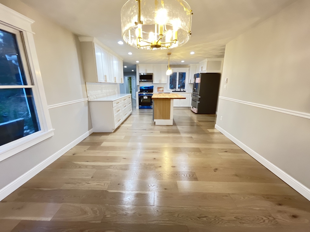 33 Highview Road Rockport, MA 01966 - Photo 24 of 31 a view of a kitchen with cabinets and wooden floor