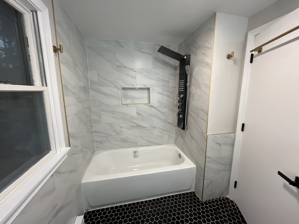 33 Highview Road Rockport, MA 01966 - Photo 7 of 31 a bathroom with a bathtub and a shower