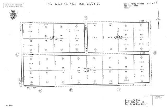 a black and white photo of a black gate
