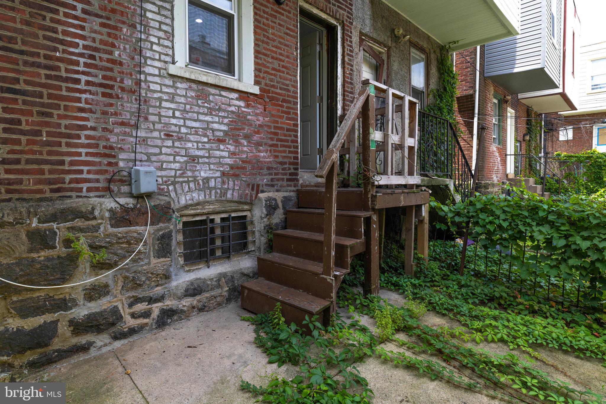 5551 Addison Street Philadelphia, PA 19143 - Photo 19 of 21 a backyard of a house with barbeque oven