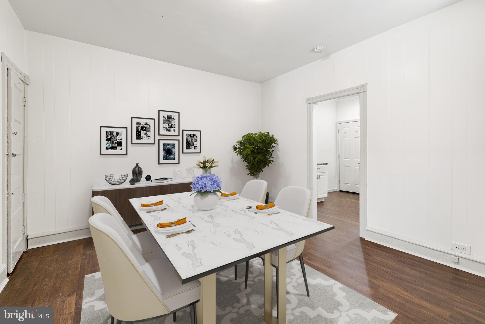 5551 Addison Street Philadelphia, PA 19143 - Photo 3 of 21 a view of a dining room with furniture and wooden floor