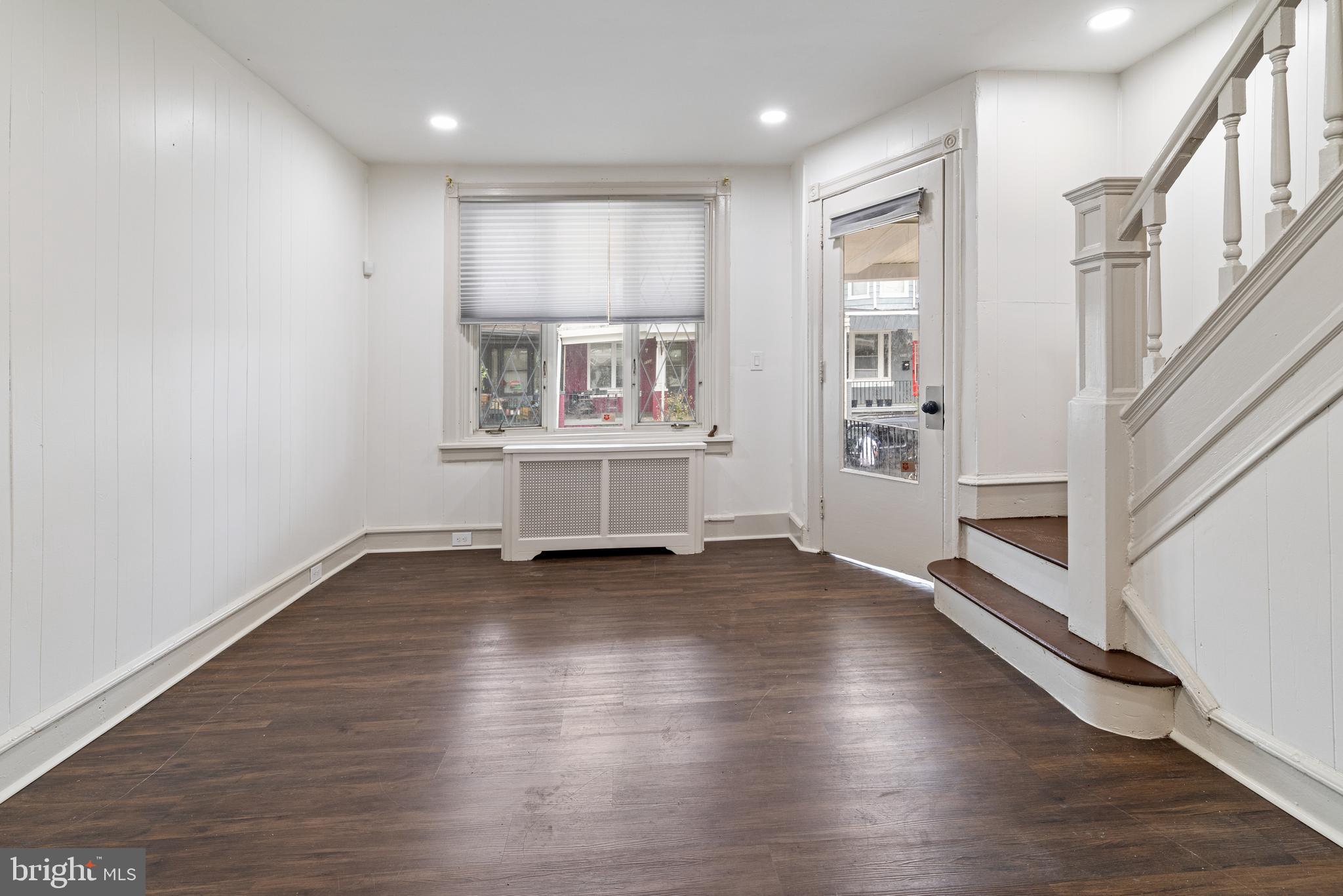 5551 Addison Street Philadelphia, PA 19143 - Photo 6 of 21 an empty room with wooden floor and windows
