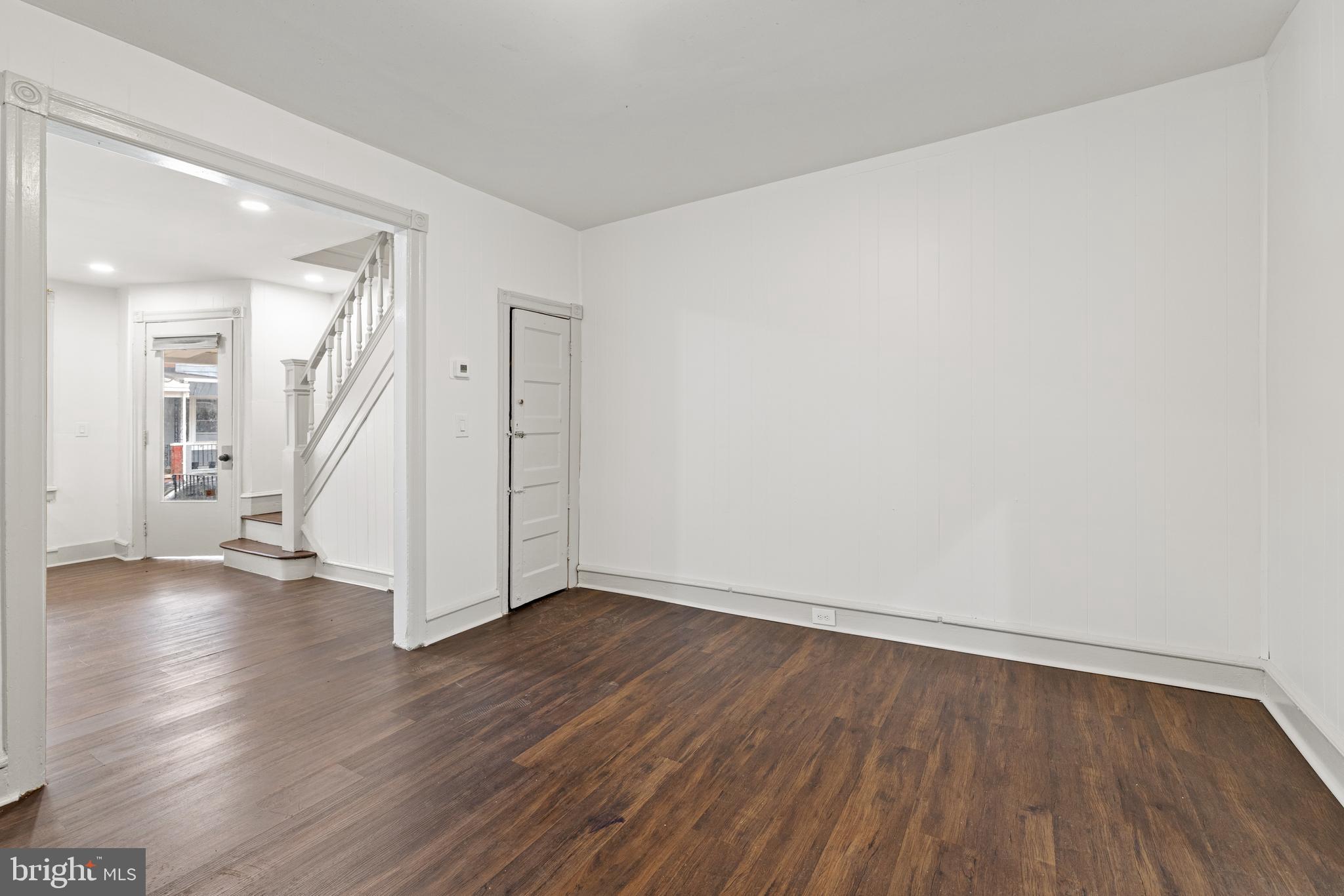 5551 Addison Street Philadelphia, PA 19143 - Photo 8 of 21 a view of an empty room with wooden floor and a window