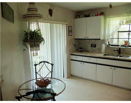 20973 Boca Ridge Drive West Boca Raton, FL 33428 - Photo 2 of 16 a kitchen with a sink and cabinets