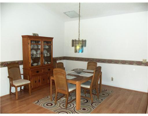 20973 Boca Ridge Drive West Boca Raton, FL 33428 - Photo 5 of 16 a view of a dining room with furniture and wooden floor