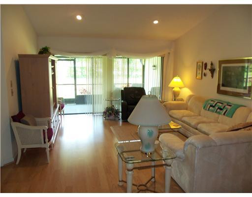 20973 Boca Ridge Drive West Boca Raton, FL 33428 - Photo 6 of 16 a living room with furniture and a flat screen tv