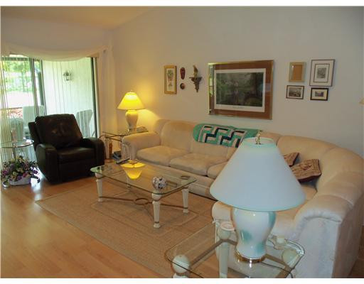 20973 Boca Ridge Drive West Boca Raton, FL 33428 - Photo 7 of 16 a living room with furniture and a lamp