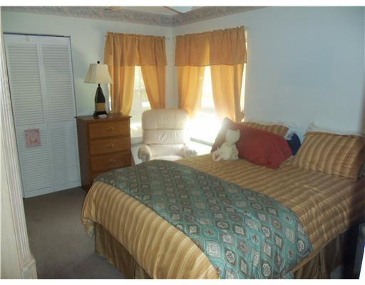 20973 Boca Ridge Drive West Boca Raton, FL 33428 - Photo 8 of 16 a bedroom with a bed and a window