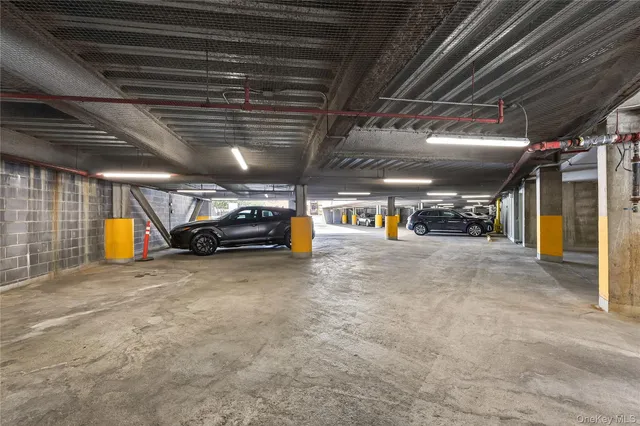 a view of parking garage with of a car