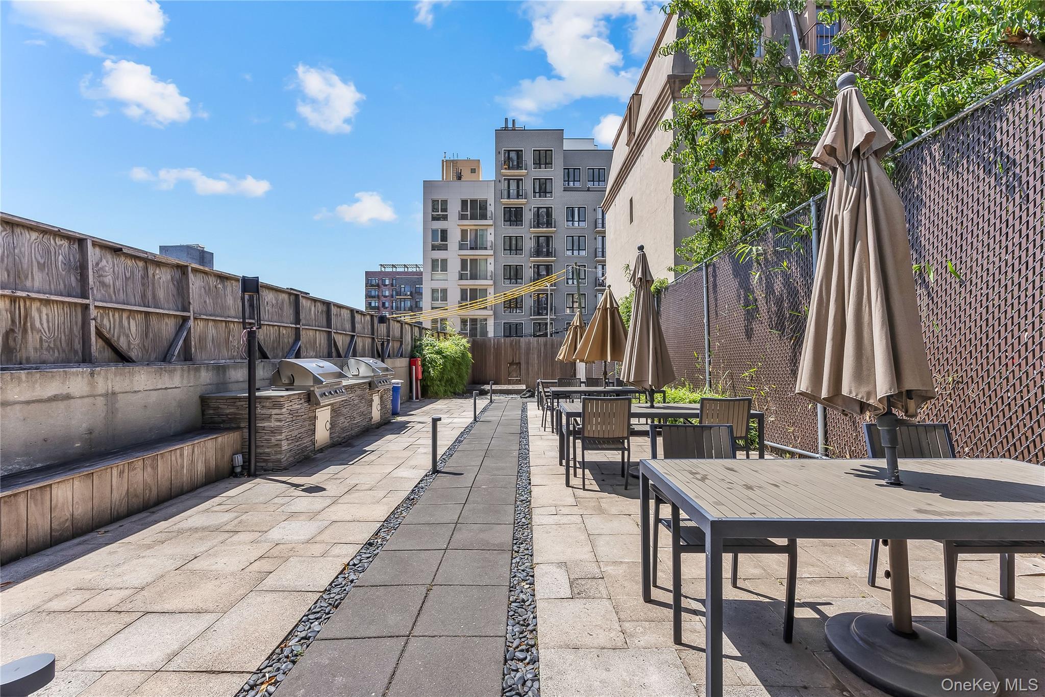 11-24 31st Avenue, Unit 12A Queens, NY 11106 - Photo 29 of 36 a view of outdoor space with seating area