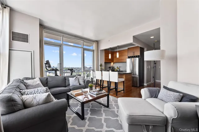 a living room with furniture and a large window