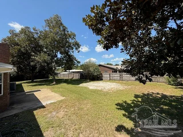 a view of a yard with swimming pool