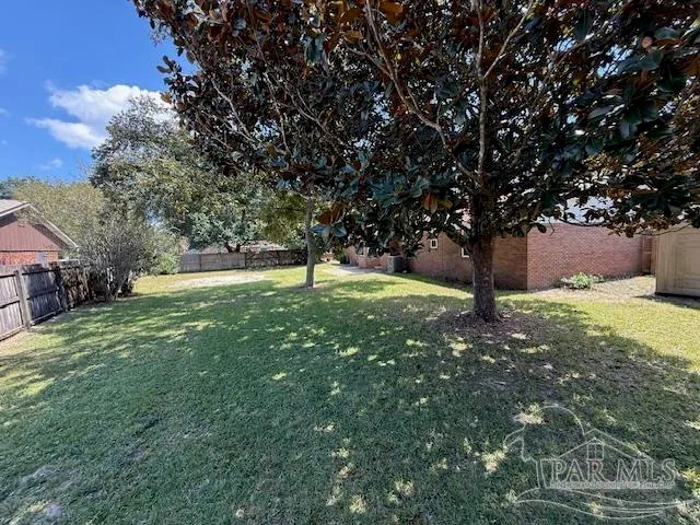 a backyard of a house with lots of green space