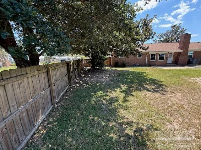 a view of a yard with trees