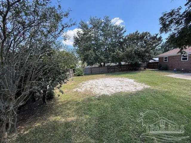 a view of a room with stairs and wooden floor