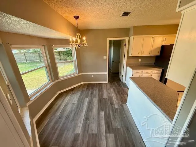 a view of a house with wooden floor and stairs