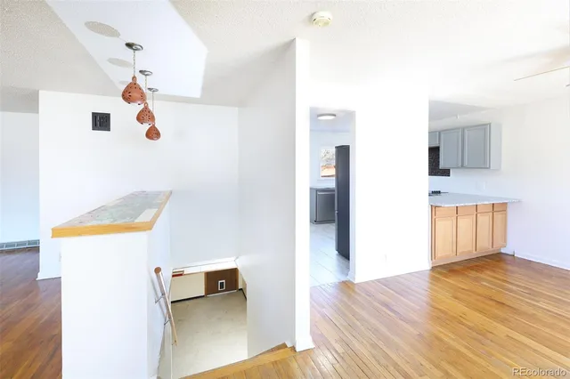a kitchen with cabinets appliances and a sink