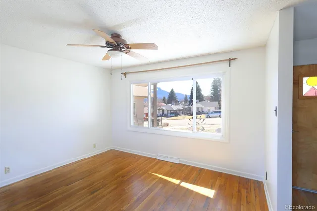a view of cabinets and wooden floor
