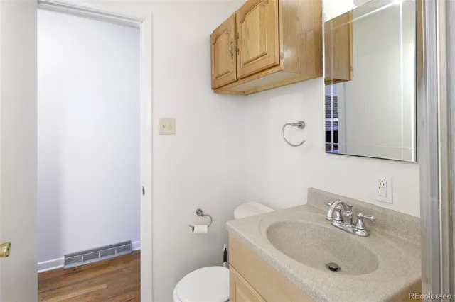 a view of a hallway with stairs