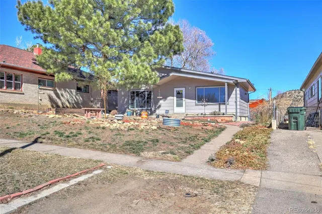 a view of a house with snow on the road