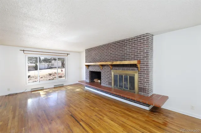 a view of livingroom with furniture wooden floor and window