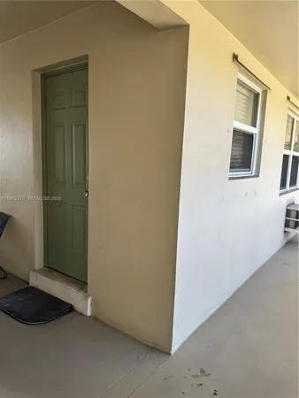 a kitchen with stainless steel appliances a stove a microwave and cabinets