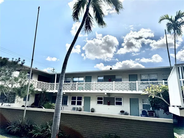 a kitchen with stainless steel appliances a refrigerator and a stove top oven