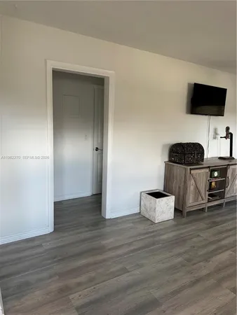 a kitchen with stainless steel appliances a stove and a microwave