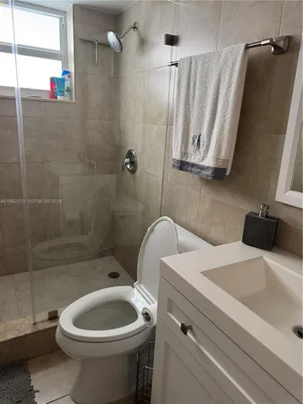 a bedroom with a bed and flat screen tv