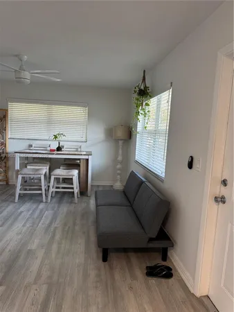 a living room with furniture and a window