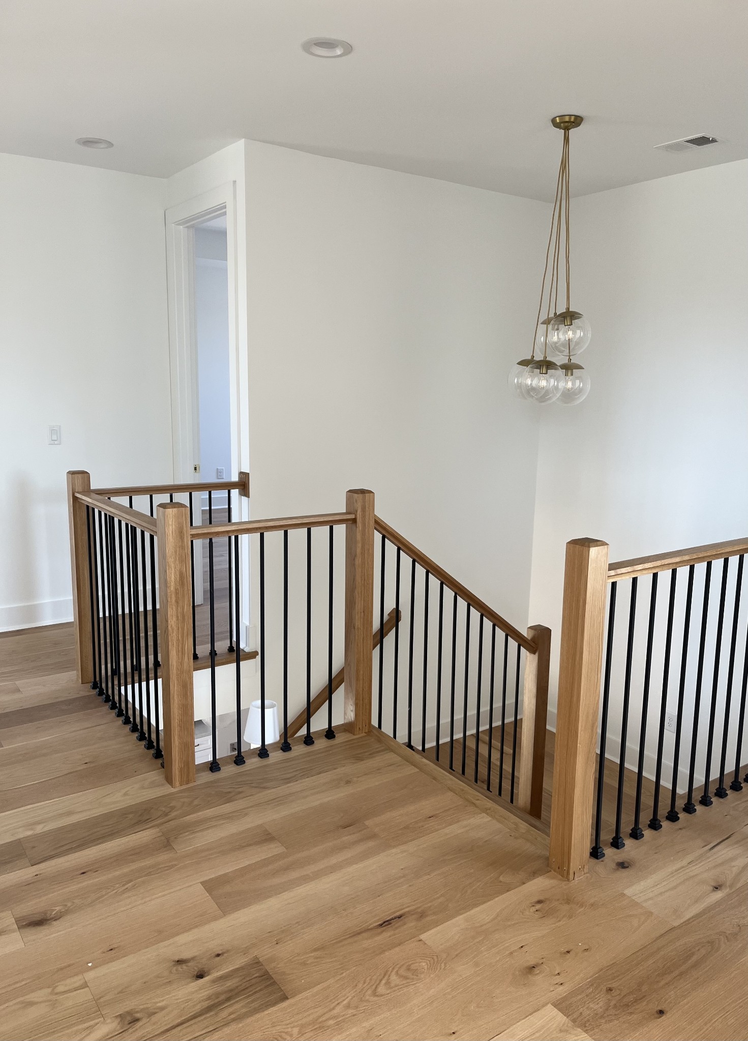 2699 Cave Springs Road Springfield, TN 37172 - Photo 19 of 26 a view of a room with wooden floor windows and a chandelier