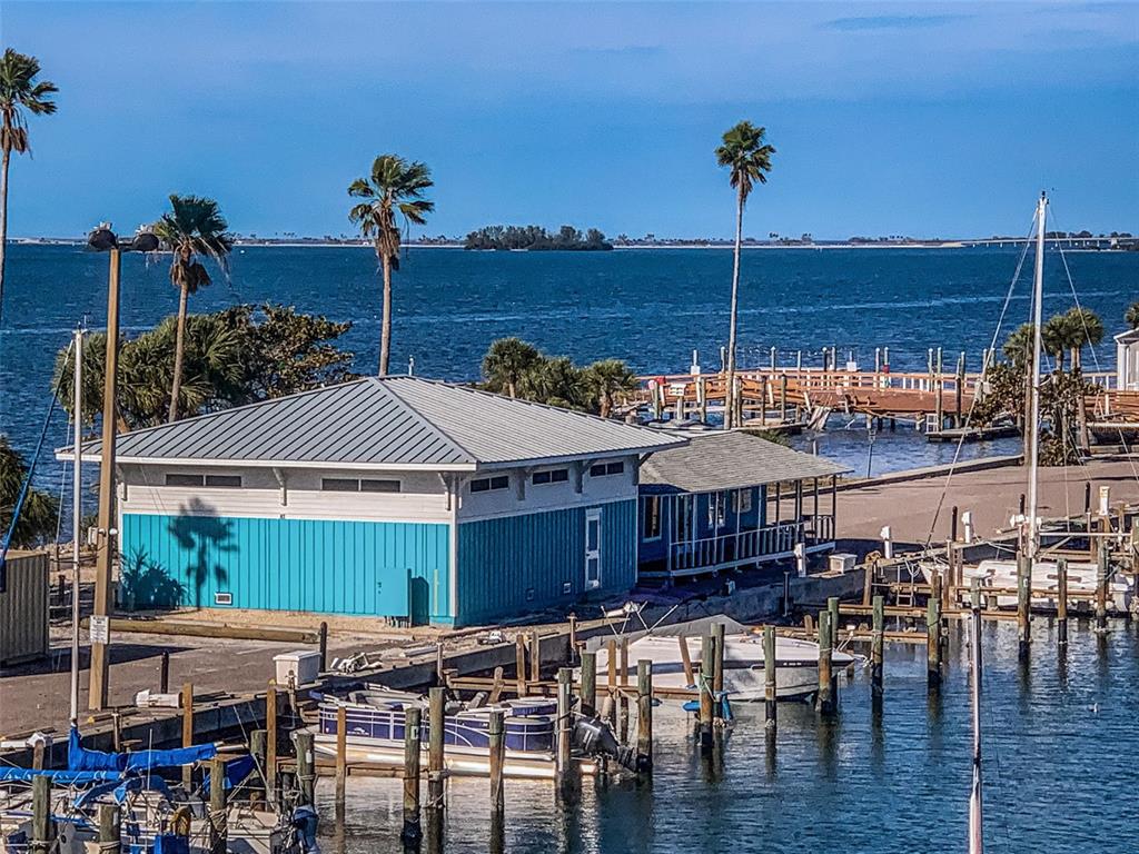 634 Edgewater Drive, Unit 447 Dunedin, FL 34698 - Photo 23 of 53 a view of a chairs and table in the patio