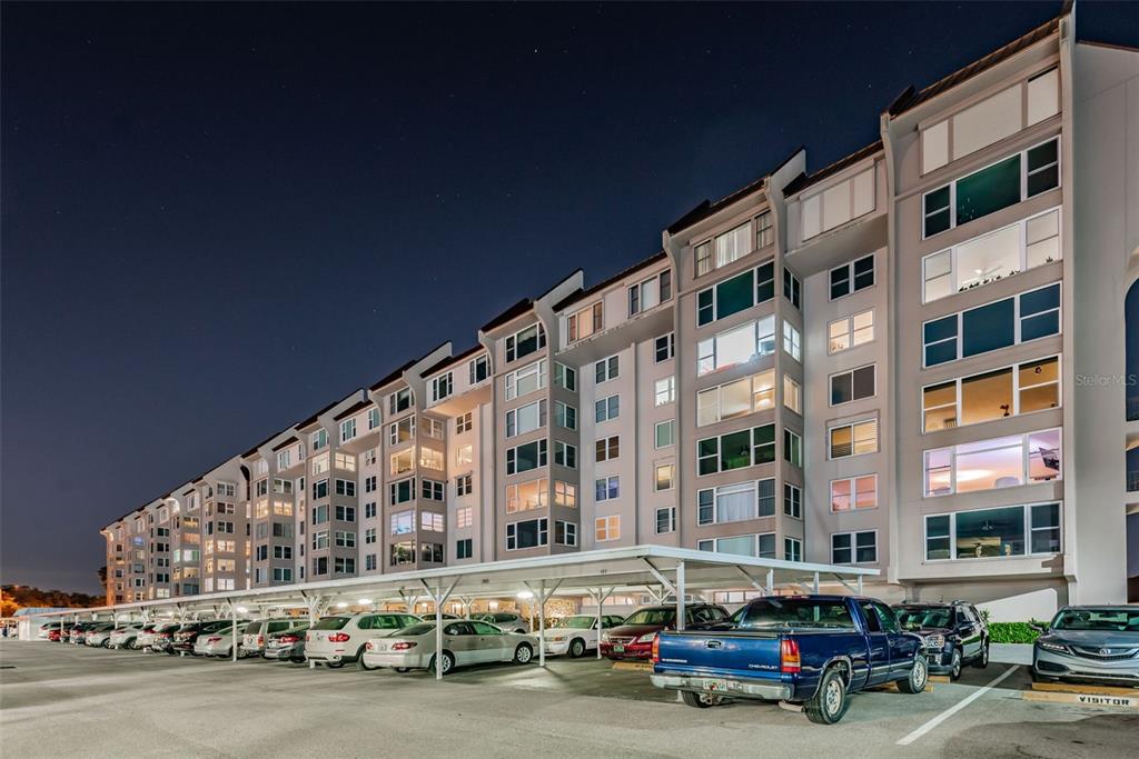 634 Edgewater Drive, Unit 447 Dunedin, FL 34698 - Photo 32 of 53 a car parked in front of a building