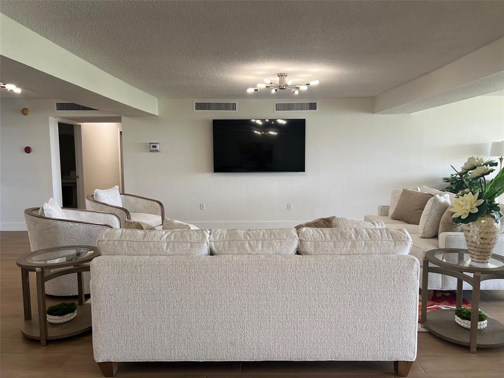 634 Edgewater Drive, Unit 447 Dunedin, FL 34698 - Photo 36 of 53 a bathroom with a sink and a mirror